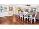 Open-concept dining area with modern table set and bar, perfect for entertaining guests at 60 Rice Ln, Edisto Beach, SC 29438