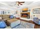Cozy living room featuring a fireplace and comfortable seating, creating an inviting atmosphere at 60 Rice Ln, Edisto Beach, SC 29438