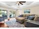 Bright living room with comfortable seating, stylish decor, and access to screened porch at 60 Rice Ln, Edisto Beach, SC 29438