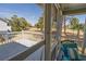 Enjoy the outdoors on the screened porch with golf course views from a relaxing seating area at 60 Rice Ln, Edisto Beach, SC 29438