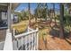 Home has nice yard with screened in porch, stairs, and trees, all contributing to beauty of the property at 60 Rice Ln, Edisto Beach, SC 29438