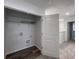 Utility closet with wood-look flooring and an open door providing access to the home's upper level at 619 Hilchot Dr, Summerville, SC 29486