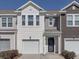 Charming townhome exterior featuring a one-car garage and well-maintained landscaping at 619 Hilchot Dr, Summerville, SC 29486