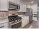 Kitchen featuring stainless steel appliances, stylish backsplash, and granite countertops at 619 Hilchot Dr, Summerville, SC 29486