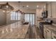 Kitchen with a large island, stainless appliances, and stylish pendant lighting at 619 Hilchot Dr, Summerville, SC 29486