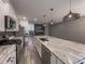 Modern kitchen with large island, stainless appliances, and stylish pendant lights at 619 Hilchot Dr, Summerville, SC 29486