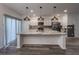 Modern kitchen with a large island, stainless steel appliances, and stylish lighting at 619 Hilchot Dr, Summerville, SC 29486