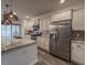 Bright kitchen features stainless appliances, a spacious island and modern pendant lighting at 619 Hilchot Dr, Summerville, SC 29486