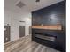 Living room with modern fireplace feature, stylish paneling, and modern flooring at 619 Hilchot Dr, Summerville, SC 29486