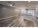 Open-concept living room with modern lighting, ceiling fan, and wood-look floors at 619 Hilchot Dr, Summerville, SC 29486
