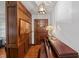 Charming entryway features wooden paneling, a piano, and a decorative pendant light fixture at 6305 Brandt St, North Charleston, SC 29406