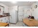 Functional kitchen with white cabinetry, a refrigerator, and a cozy dining area at 6305 Brandt St, North Charleston, SC 29406