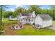 Inviting backyard with outdoor fire pit, custom garden beds, and outdoor lounge space at 6373 Farm House Rd, Ravenel, SC 29470