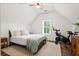 Bedroom featuring a bed with a patterned throw, with a window and a spinning bike at 6373 Farm House Rd, Ravenel, SC 29470