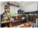 Bonus room with leather couch, guitar, gun rack and decorative decor at 6373 Farm House Rd, Ravenel, SC 29470