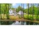 Charming two-story home by the water with a cozy fire pit and outdoor entertaining area at 6373 Farm House Rd, Ravenel, SC 29470