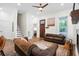 Cozy living room featuring hardwood floors, a fireplace, and comfortable seating at 6373 Farm House Rd, Ravenel, SC 29470