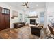 Inviting living room with a fireplace, hardwood floors, and comfortable seating at 6373 Farm House Rd, Ravenel, SC 29470