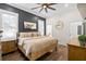 Inviting main bedroom with a ceiling fan and a rustic wood bed frame at 6373 Farm House Rd, Ravenel, SC 29470