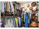 Organized walk-in closet with hanging clothes, hats and boots offering plenty of storage space at 6373 Farm House Rd, Ravenel, SC 29470