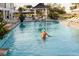 Relaxing poolside scene featuring clear blue water and serene atmosphere in a luxury resort at 7059 Sounding Ln, Johns Island, SC 29455