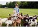 Lush acreage with goats, ideal for hobby farming or outdoor living in a serene country setting at 7059 Sounding Ln, Johns Island, SC 29455