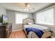 Bedroom featuring hardwood floors, a ceiling fan and a dresser with a television at 757 Longfellow Rd, Charleston, SC 29407