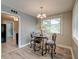 Charming dining area featuring a glass table, ornate chairs, and a stylish chandelier at 757 Longfellow Rd, Charleston, SC 29407