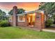 Close up of the red brick, one story home with front door at 757 Longfellow Rd, Charleston, SC 29407