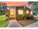 A charming brick home featuring a cozy front porch and updated lighting at 757 Longfellow Rd, Charleston, SC 29407