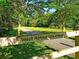 Scenic West Ashley Greenway entrance with a wooden fence, a paved trail, and lush greenery at 757 Longfellow Rd, Charleston, SC 29407
