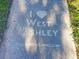 A sidewalk with an inscription, 'I (heart) West Ashley' and 'GRANDNEWLIVING.COM' etched into it at 757 Longfellow Rd, Charleston, SC 29407