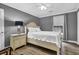 Comfortable bedroom with gray walls, wood floors, and modern ceiling fan at 7911 Windfern Ct # 1502, North Charleston, SC 29418