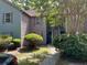Charming multi-level condominium featuring a welcoming entrance and verdant landscaping at 7911 Windfern Ct # 1502, North Charleston, SC 29418