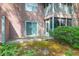 View of the back of the home, highlighting the exterior with sliding glass doors and outdoor space at 7911 Windfern Ct # 1502, North Charleston, SC 29418