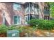 View of the back of the home, highlighting the exterior with sliding glass doors and outdoor space at 7911 Windfern Ct # 1502, North Charleston, SC 29418