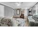 Open concept living space featuring hardwood floors, modern furnishings, and a decorative mirror at 7911 Windfern Ct # 1502, North Charleston, SC 29418