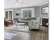 Cozy living room featuring a fireplace, plush rug, and ample natural light from a sliding glass door at 7911 Windfern Ct # 1502, North Charleston, SC 29418