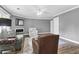 Spacious living room with a gray color scheme, fireplace, and a ceiling fan for added comfort at 7911 Windfern Ct # 1502, North Charleston, SC 29418