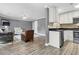 Combined living space with kitchen, hardwood floors, comfortable seating, and a modern design at 7911 Windfern Ct # 1502, North Charleston, SC 29418