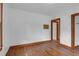 Bright bedroom features wood trim, neutral walls, and natural light at 809 N Magnolia St, Summerville, SC 29483