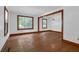 Bright living room with wood trim and large windows, offering natural light and a view of the outdoors at 809 N Magnolia St, Summerville, SC 29483