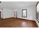 Spacious room with hardwood floors and natural light, showing the home's potential for comfortable living at 809 N Magnolia St, Summerville, SC 29483
