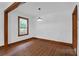 Well-lit room featuring hardwood floors, natural light, and white walls, offering a clean and adaptable space at 809 N Magnolia St, Summerville, SC 29483