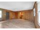 Spacious living room with wood paneling and wood-look flooring at 809 N Magnolia St, Summerville, SC 29483