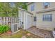 Home backyard features a patio area with table and chairs, a utility access door, and AC unit at 811 Reserve Way, Summerville, SC 29485