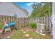 Cozy fenced backyard featuring a grill, AC unit, and stepping stones to access the property at 811 Reserve Way, Summerville, SC 29485