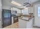 Bright kitchen features white cabinets, granite countertops, and stainless steel appliances at 811 Reserve Way, Summerville, SC 29485