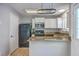 The kitchen features white cabinets, stone countertops, and stainless appliances at 811 Reserve Way, Summerville, SC 29485