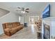 Spacious living room with wood floors, fireplace and comfortable brown couch at 811 Reserve Way, Summerville, SC 29485